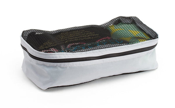 A filled and zipped closed Northwest Sky (light grey) Aether Small Aeronaut 30 Packing Cube.